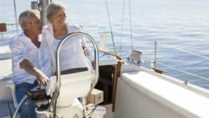 Happy retired couple on a yacht