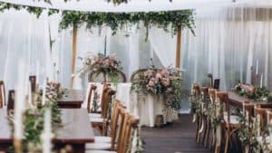 Wedding table for a newlywed banquet with eco decor and floral design in the style of boho.
