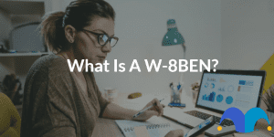 Working from home due to social distancing with the text “What is a W-8BEN?” and The Motley Fool jester cap logo