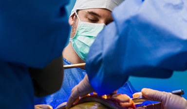 Healthcare, doctors performing surgery