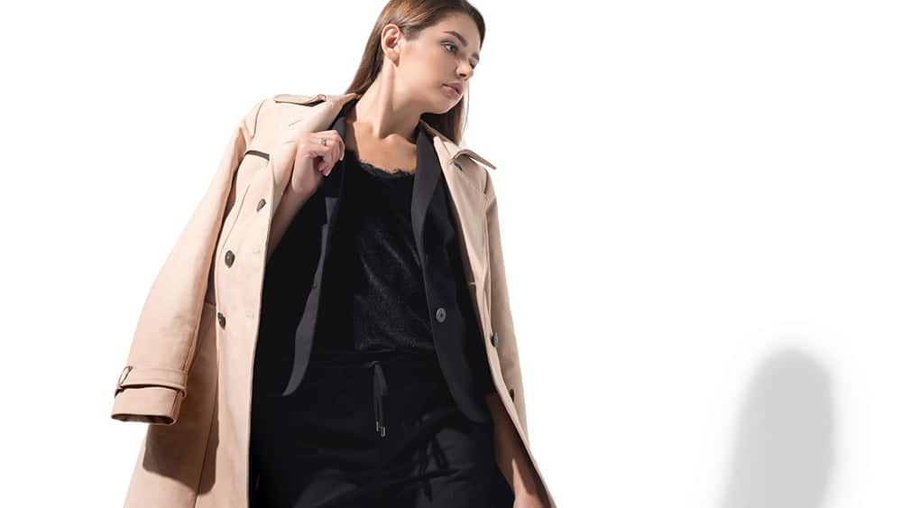 Female fashion model, modelling a trench coat