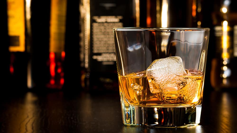 A glass of whiskey-on-the-rocks
