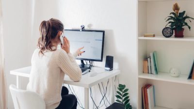 Young lady working from home office during coronavirus pandemic.