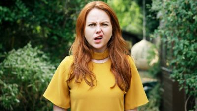 Woman pulling baffled face