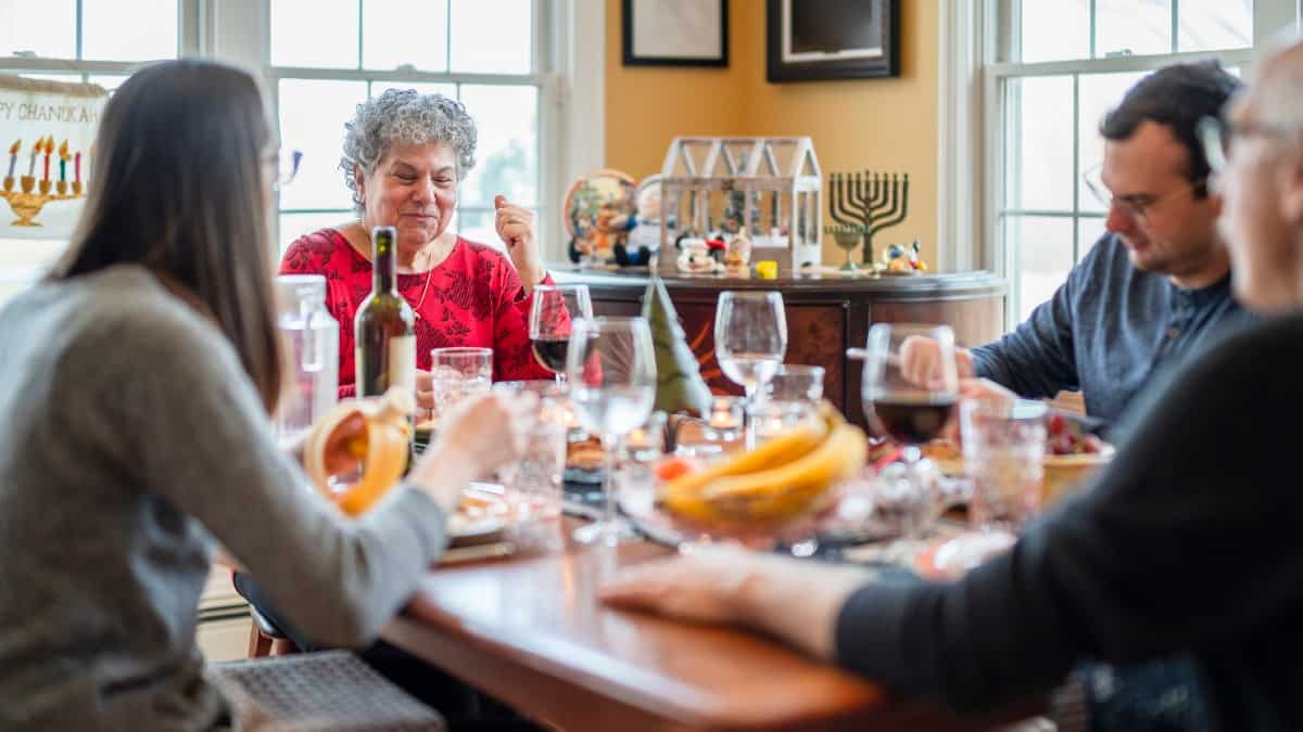 Two-generation multi-religious family celebrating both Christmas and Hanukkah together