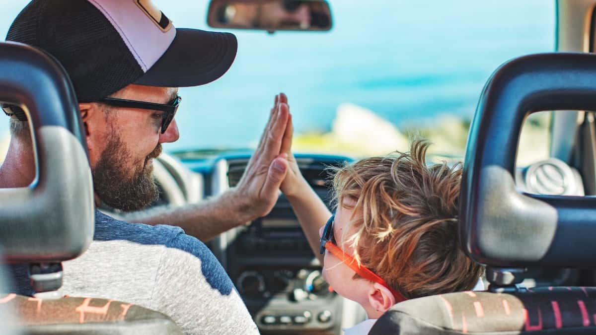 Road trip. Father and son travelling together by car