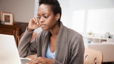 African American woman working in home office