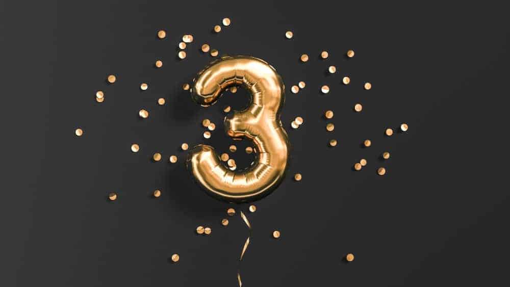 Number 3 flying foil balloon and gold confetti