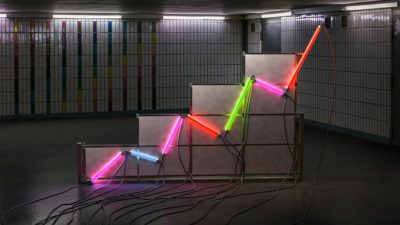 A graph made of neon tubes in a room