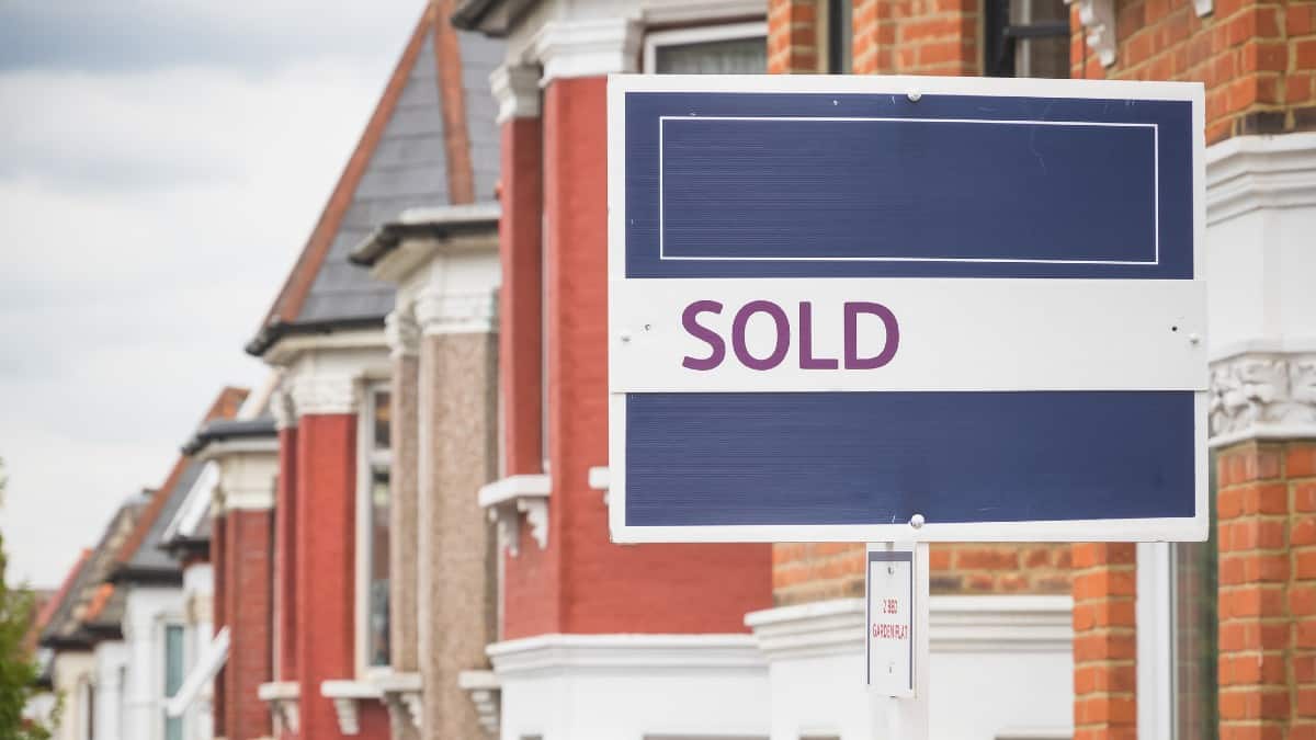 Sold sign displayed outside a terraced house