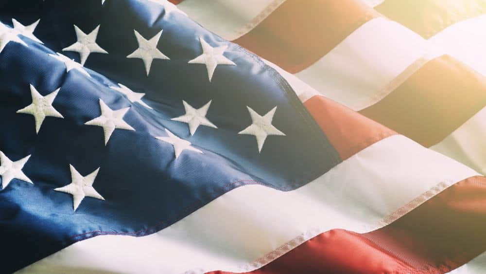Closeup ruffled American flag representing US stocks and shares