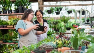 Female florist with Down's syndrome working in small business