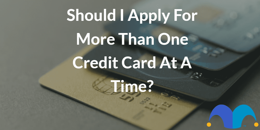 Stack of credit cards with the text “Should I apply for more than one credit card at a time?” and The Motley Fool jester cap logo