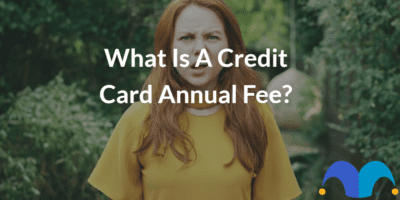 Confused girl with the text “What is a credit card annual fee” and The Motley Fool jester cap logo