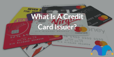 Pile of credit cards with the text “What is a credit card issuer?” and The Motley Fool jester cap logo