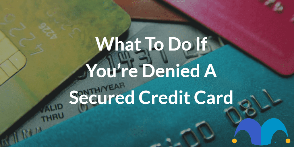 Pile of credit cards with the text “What to do if you’re denied a secured credit card” and The Motley Fool jester cap logo