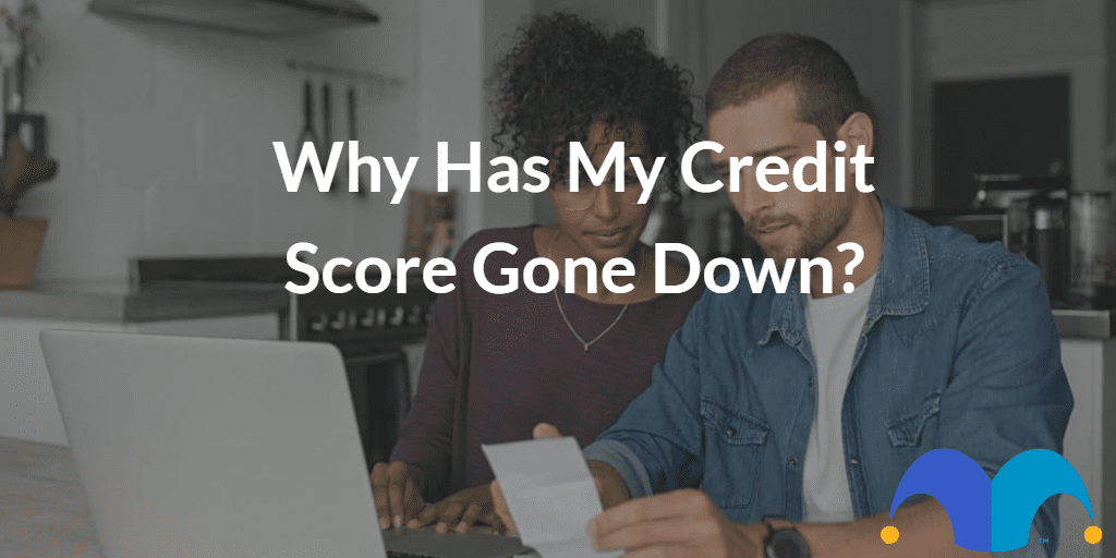 Couple researching online with the text “Why has my credit score gone down?” and The Motley Fool jester cap logo