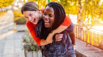 Mixed-race female couple enjoying themselves on a walk