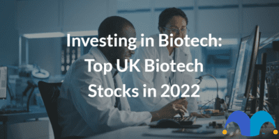 Engineer Project Manager Talks With Scientist working on Computer with the text “Investing in Biotech: Top UK Biotech Stocks in 2022” and The Motley Fool jester cap logo