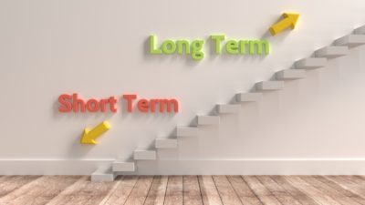 Long-term vs short-term investing concept on a staircase