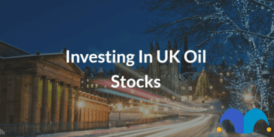 Christmas lights in streets with the text “Investing in UK oil stocks” and The Motley Fool jester cap logo