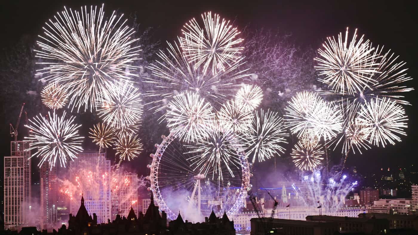 Midnight is celebrated along the River Thames in London with a spectacular and colourful firework display.