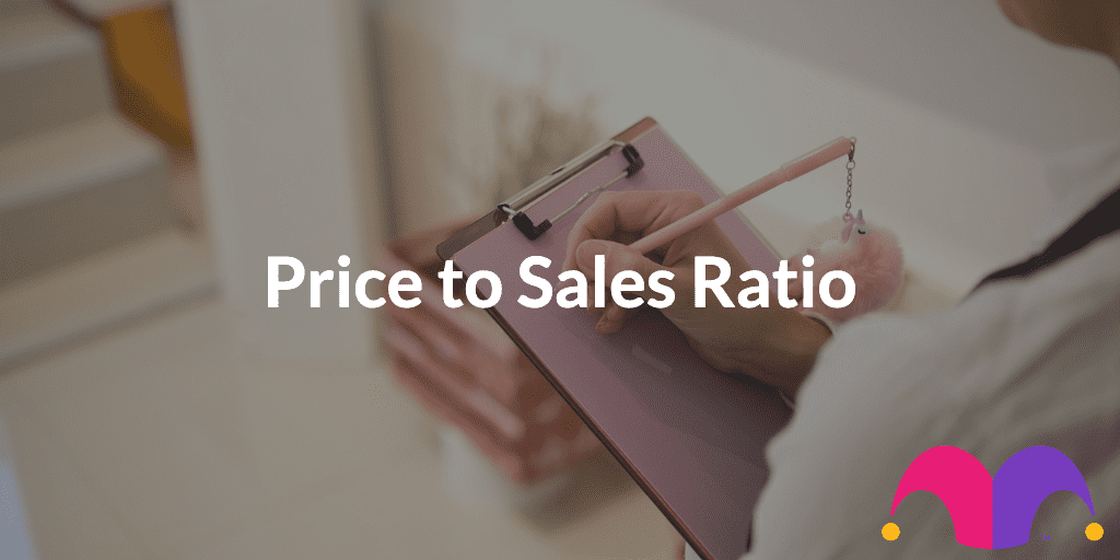 A person writing on a clipboard with the text "Price to Sales Ratio"