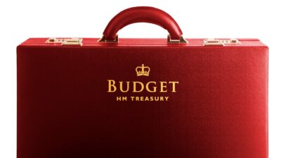 Red briefcase with the words Budget HM Treasury embossed in gold