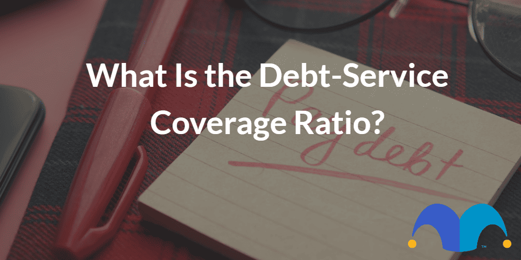 Paper with pay debt written on it with the text “What Is the Debt-Service Coverage Ratio?” and The Motley Fool jester cap logo