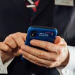 British Airways cabin crew with mobile device