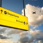 Departure & Arrival sign, representing selling and buying in a portfolio